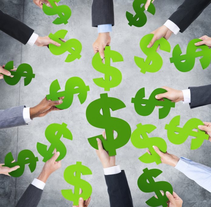 Multi,Ethnicity,Of,Human,Hands,Around,The,Currency,Sign