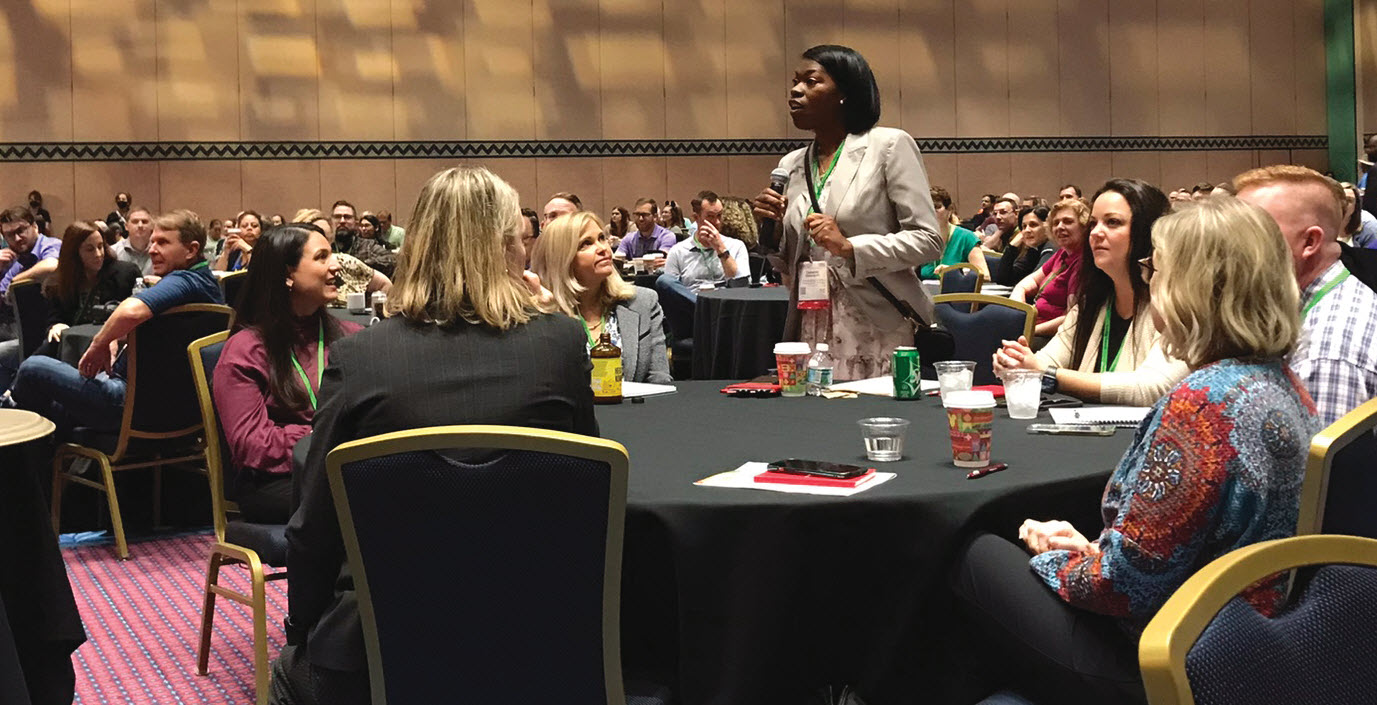An attendee poses a question to keynoter Shawn Achor.