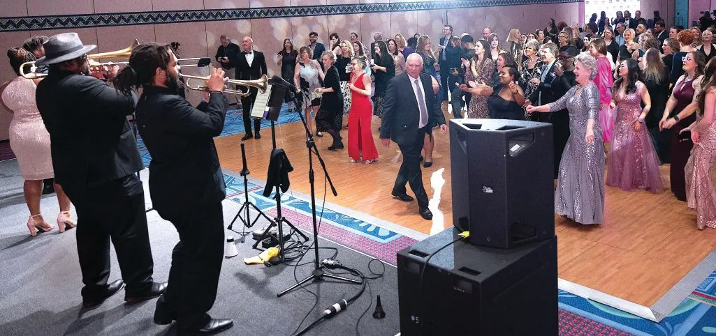 It’s all about the brass for these dancers. PHOTOGRAPHY BY HUGHES FIORETTI PHOTOGRAPHY