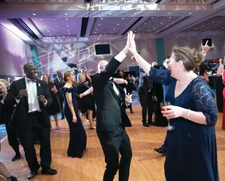 High-fives on the floor. PHOTOGRAPHY BY HUGHES FIORETTI PHOTOGRAPHY