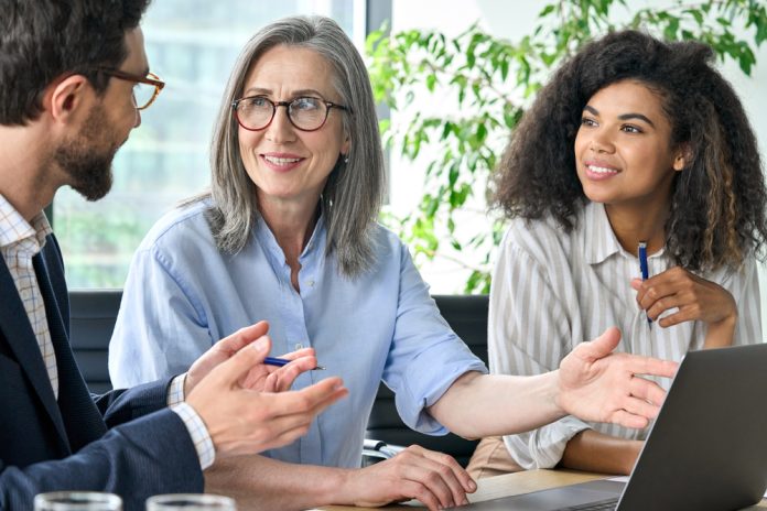 Happy,Diverse,Business,People,Group,Negotiating,Business,Strategy,At,Boardroom