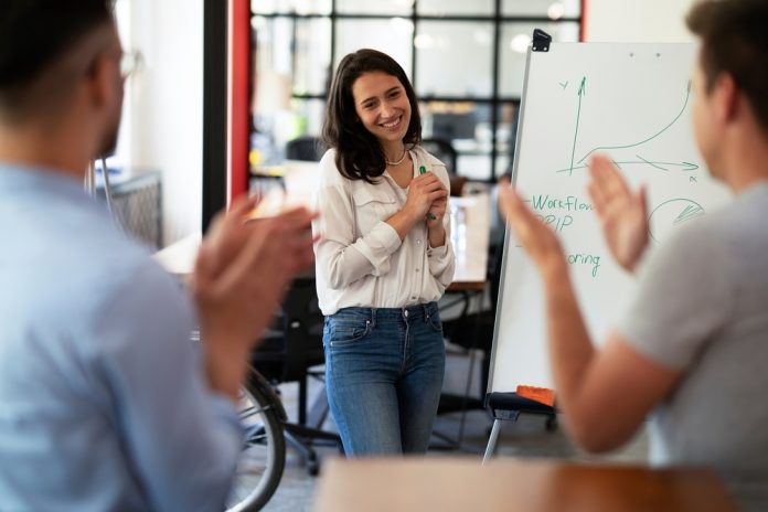 Businesswoman,Present,Her,Idea,To,Working,Team.,Young,Beautiful,Woman