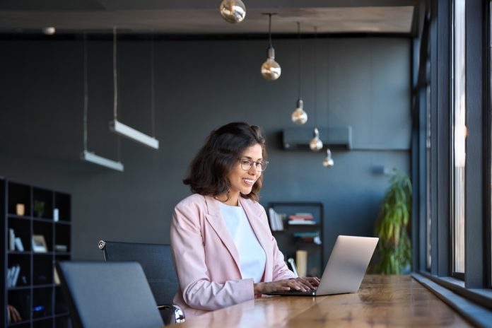 Happy,Latin,Hispanic,Young,Business,Woman,Working,On,Laptop,Computer