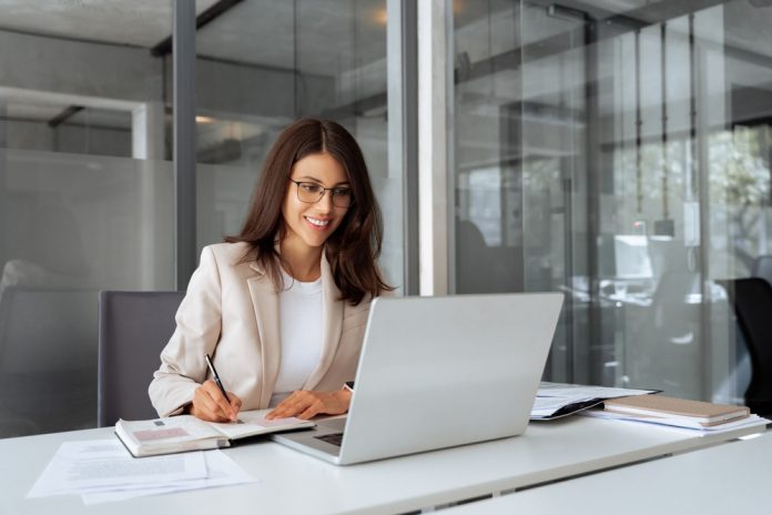 Middle-age,Latin,Woman,Using,Laptop,Computer,For,Business,Studying,,Having