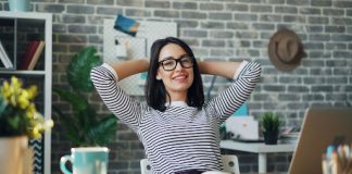 Woman sitting back in a desk chair